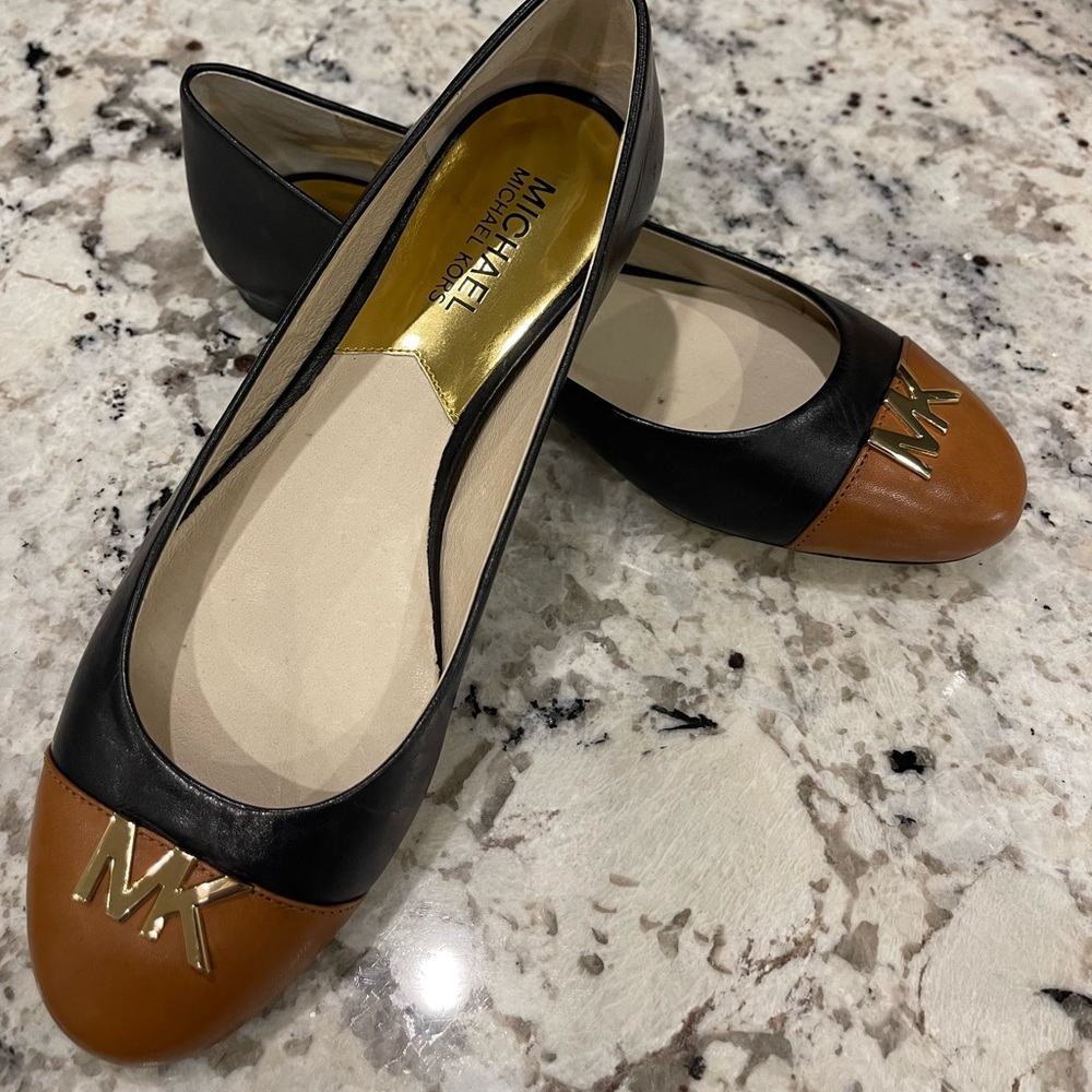 Classic Michael Kors ballet flats in Black and Tan. New without box.